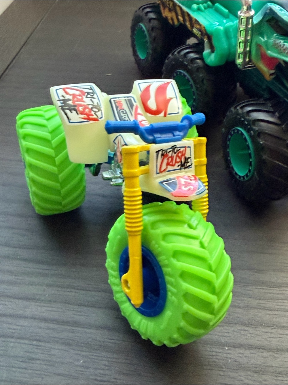 Monster Truck Lot…three wheeler, toilet monster truck and extra large Dino